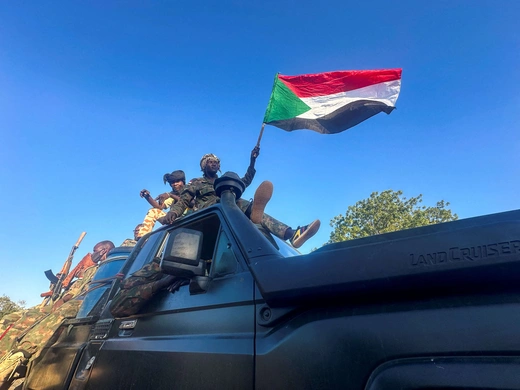 Sudanese Armed Forces soldiers celebrate after entering Wad Madani, in Sudan, on January 12, 2025.