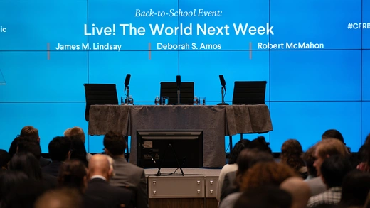 CFR stage in Washington D.C. with "The World Next Week" projected on the screen.