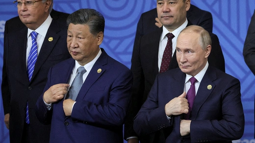 Russian President Vladimir Putin stands with Chinese President Xi Jinping at a BRICS Plus meeting in Kazan, Russia, October 2024. 