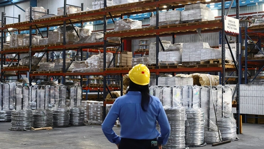 An employee works at Trefilados Inoxidables de México, which exports manufactured aluminum, nickel alloys, and stainless steel wire to the United States, in Tlaxcala, Mexico.