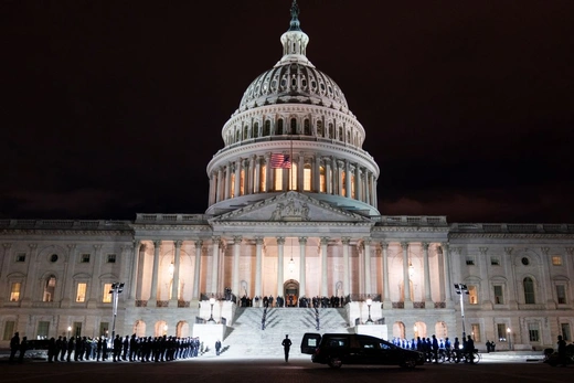 The remains of Capitol Police Officer Brian Sicknick, who died from injuries sustained during the January 6th insurrection at the U.S. Capitol, is carried up the East Front steps prior to lying in honor in the Rotunda of the U.S. Capitol in Washington, DC, U.S. February 02, 2021.