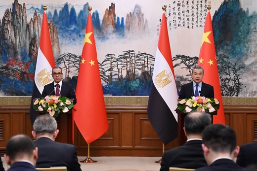 China’s Foreign Minister Wang Yi speaks during a joint briefing as Egypt’s Foreign Minister Badr Abdelatty looks on at the Diaoyutai State Guesthouse in Beijing, China on December 13, 2024. GREG BAKER/POOL/AFP via Getty Images