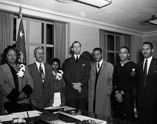 Secretary of the Army Frank Pace with the family of Sergeant Cornelius H. Charlton at the Pentagon at the presentation of Sergeant Charlton’s posthumous Medal of Honor.