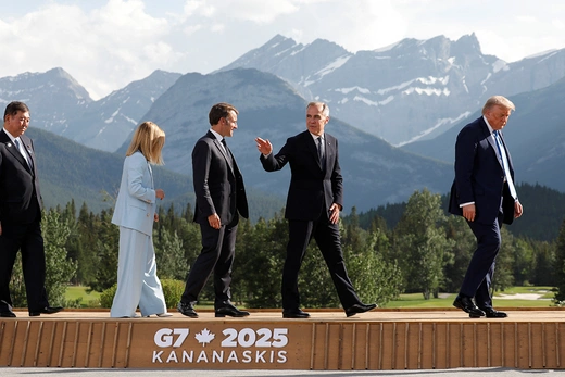 Japan's Prime Minister Shigeru Ishiba, Italy's Prime Minister Giorgia Meloni, France's President Emmanuel Macron, Canada Prime Minister Mark Carney, and U.S. President Donald Trump walk after posing for a photo at the G7 Summit in June.