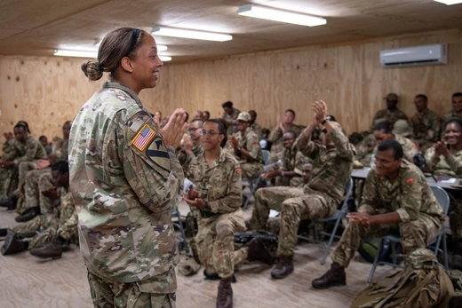 Major Tiffani Summers, Public Affairs officer from US Army, interacts with the troops during a women, peace and security briefing as part of Exercise TRADEWINDS at Camp Seweyo, Guyana on 19 July 23.