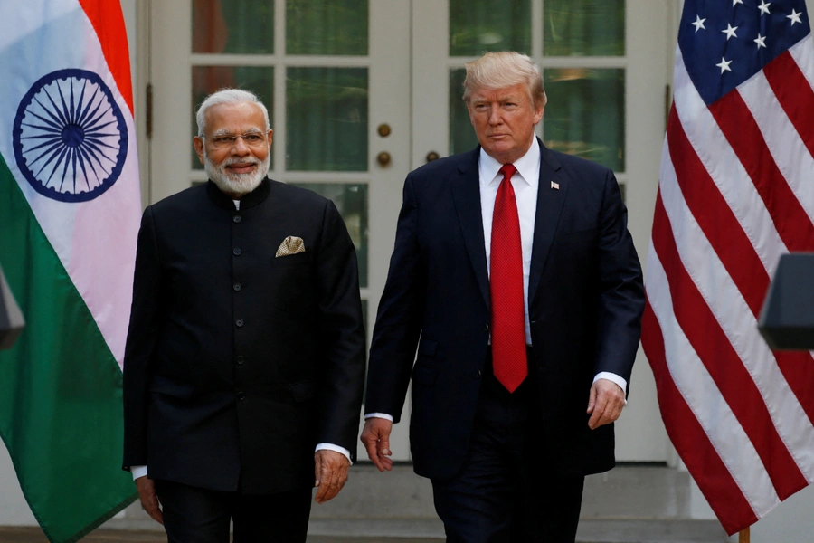 U.S. President Donald Trump (R) arrives for a joint news conference with Indian Prime Minister Narendra Modi in the Rose Garden of the White House in Washington, U.S., June 26, 2017. REUTERS/Kevin Lamarque