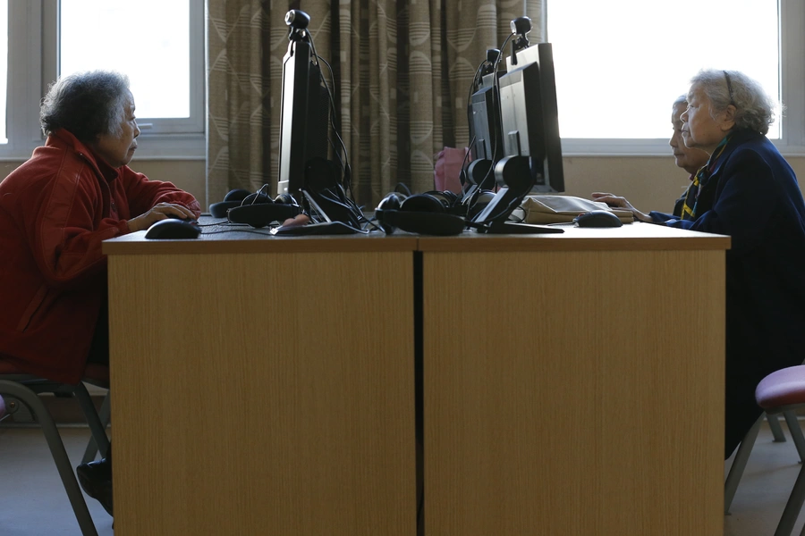 Residents of the Beijing First Social Welfare Institution-affiliated nursing home use the Internet during their recreational time in the facility in Beijing March 1, 2013. The nursing home is one of the prestigious care centres for the elderly in China and accommodates about 1,000 seniors. China's elderly population will hit 360 million by 2030, from about 200 million in 2013. REUTERS/Kim Kyung-Hoon