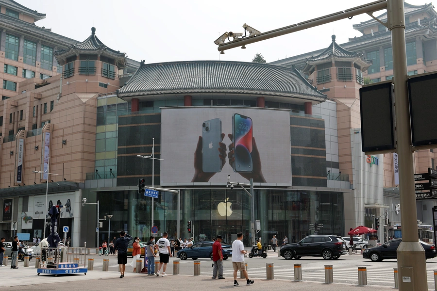 Surveillance cameras are seen near an iPhone advertisement at an Apple store in Beijing, China September 7, 2023. REUTERS/Florence Lo