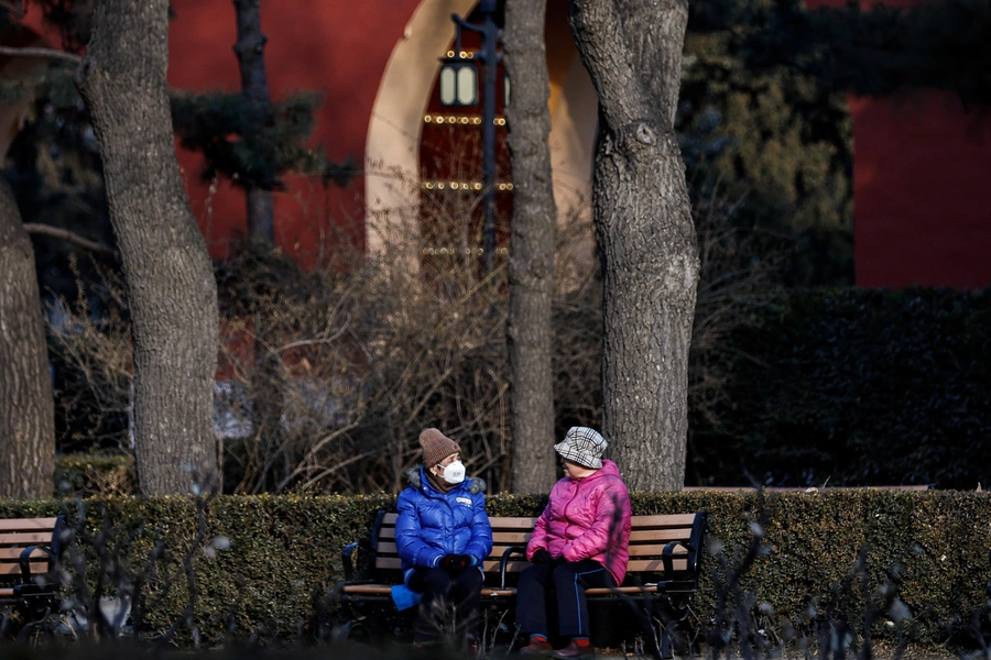 Elderly people rest and chat at a park in Beijing, January 16, 2024. Tingshu Wang/Reuters