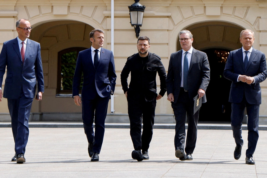 German Chancellor Friedrich Merz, French President Emmanuel Macron, Ukranian President Voloydmyr Zelenskyy, British Prime Minister Keir Starmer and Polish Prime Minister Donald Tusk walk in the grounds of Mariynsky Palace, in Kyiv, Ukraine, on May 10. Ludovic Marin/Pool/Reuters