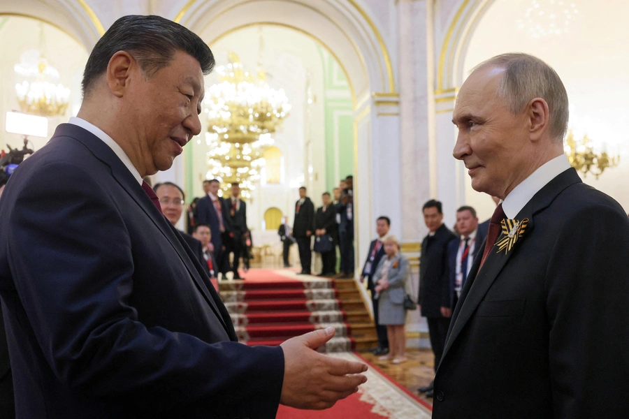 Russian President Vladimir Putin shakes hands with Chinese President Xi Jinping during a reception, held on Victory Day marking the 80th anniversary of the victory over Nazi Germany in World War Two, at the Kremlin in Moscow, Russia, May 9, 2025. Sputnik/Mikhail Metzel/Pool via REUTERS