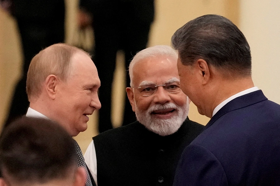 Indian Prime Minister Narendra Modi talks with Russian President Vladimir Putin and Chinese President Xi Jinping ahead of the Shanghai Cooperation Organization (SCO) Summit 2025 at the Meijiang Convention and Exhibition Centre in Tianjin, China. SUO TAKEKUMA/Pool via REUTERS