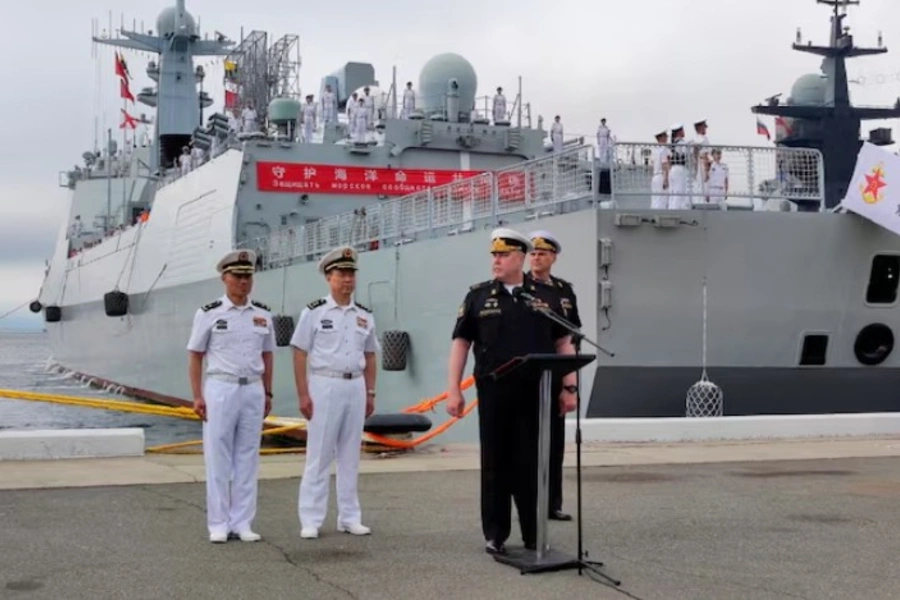 Chinese and Russian naval officers take part in a ceremony marking the start of joint naval drills in the Sea of Japan. Russian Defence Ministry/Russia's Pacific Fleet/Reuters
