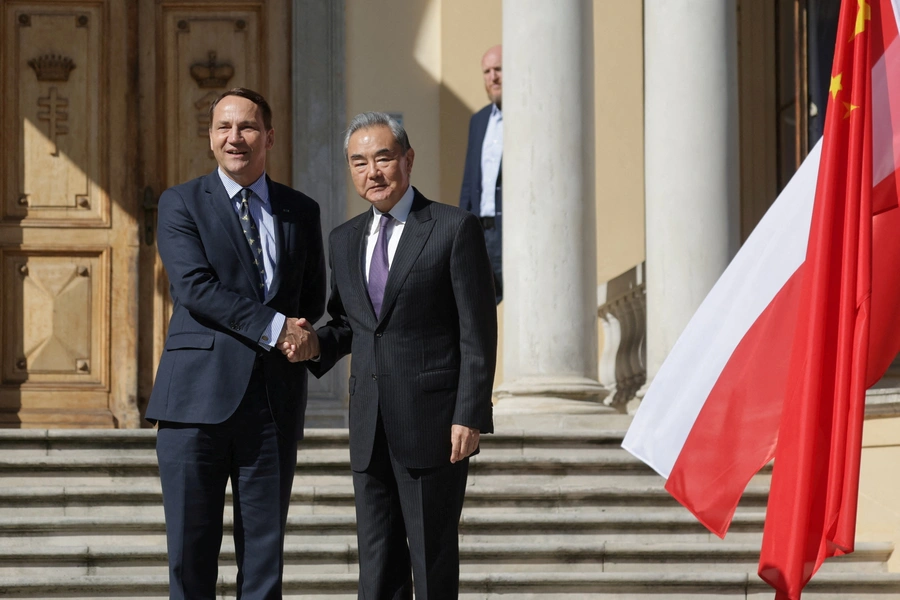Polish Foreign Minister Radoslaw Sikorski shakes hands with Chinese Foreign Minister Wang Yi at the Polish Defence Ministry's Representative Centre in Pruszkow, Poland, September 15, 2025. Agencja Wyborcza.pl/Kuba Atys via REUTERS