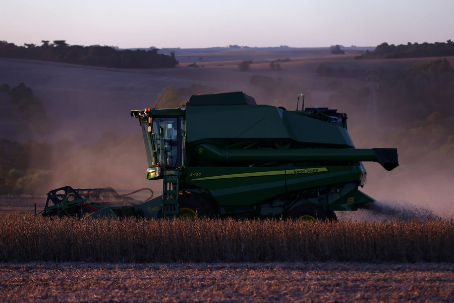 A farm worker operates a combine harvester during the soybean harvest season in Brazil's southernmost state, on a farm in Nao Me Toque, Rio Grande do Sul state, Brazil, April 4, 2025. Reuters/Diego