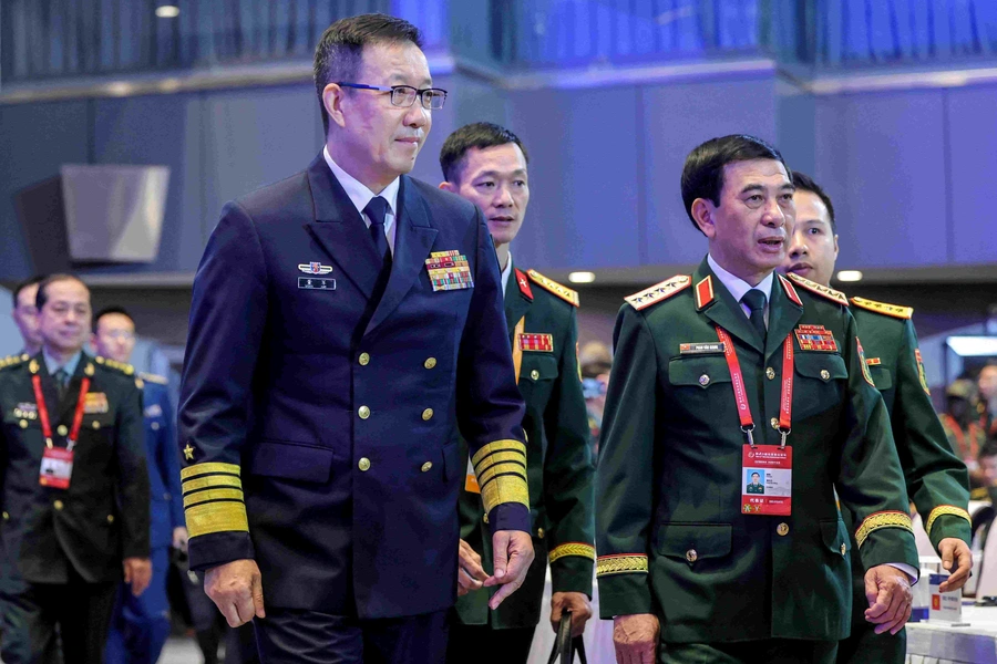 Chinese Defence Minister Dong Jun and Vietnam’s Defense Minister General Phan Van Giang arrive at the hall at Beijing Xiangshan Forum in Beijing, China, on September 18, 2025. Maxim Shemetov/Reuters