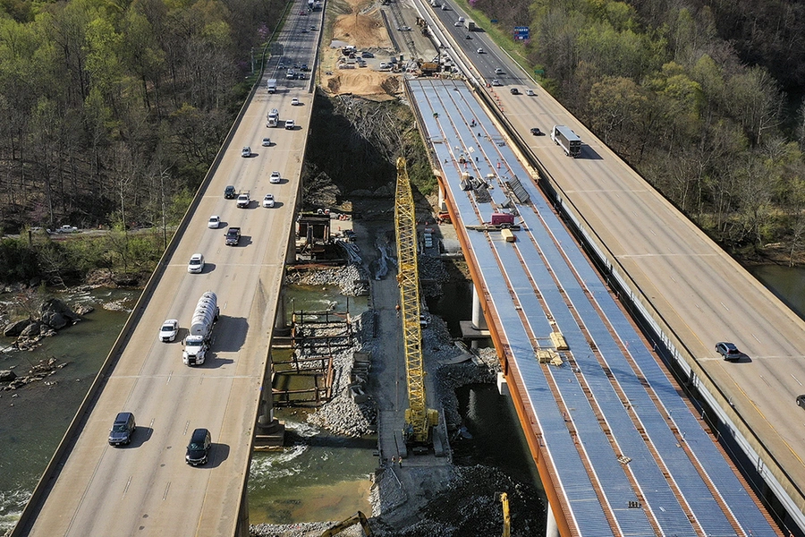 FREDERICKSBURG, VA - APRIL 6: In an aerial view, vehicles on Interstate 95 travel past a construction project to add three lanes to the I-95 Rappahannock River Crossing on April 6, 2021 in Fredericksburg, Virginia.