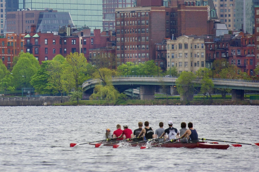 View of rowing team on Charles river, practicing.