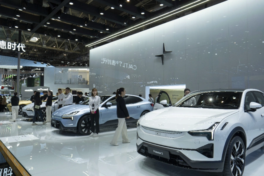 People touring electric vehicles in a store