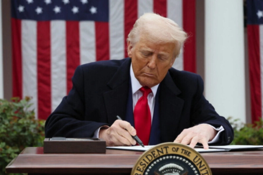 Donald Trump signs an executive order on tariffs, in the Rose Garden at the White House on April 2, 2025. Leah Millis/Reuters