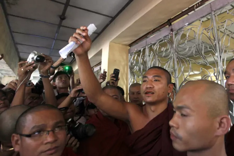 Shin Gambira (center), leader of the All-Burmese Monks Alliance, talks to supporters in January, 2012, after his release from prison. BBC News reported Friday that he has been once again taken away by Burmese authorities. (Soe Zeya Tun/Courtesy Reuters)