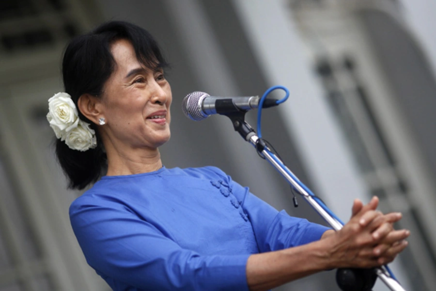 Myanmar's pro-democracy leader Aung San Suu Kyi talks during a news conference after her meeting with U.N. Special Rapporteur Tomas Ojea Quintana at her home in Yangon February 3, 2012.