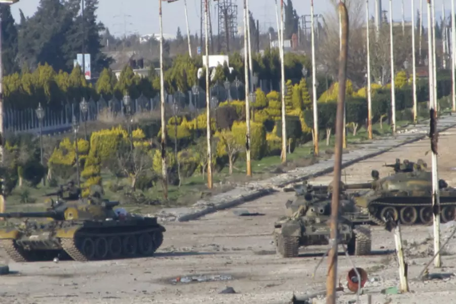 Syrian tanks are seen in Bab Amro near the city of Homs February 12, 2012. Syrian forces resumed their bombardment of the city...m neighbourhoods that have been at the forefront of opposition to President Bashar al-Assad. (Courtesy Mulham Alnader/REUTERS)