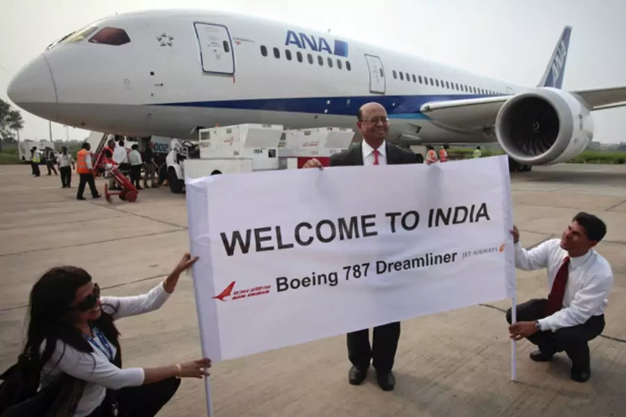 The president of Boeing India poses in front of the Boeing 787 Dreamliner aircraft for All Nippon Airways (ANA) after its India debut landing in New Delhi in July 2011 (B Mathur/Courtesy Reuters).