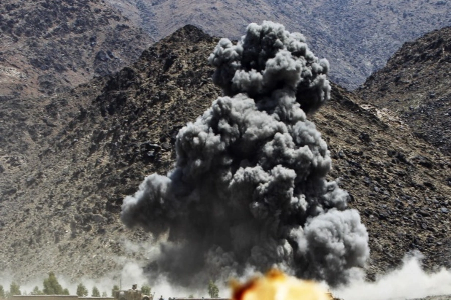 An explosion after airstrikes by NATO-led forces during fighting against Taliban insurgents in Afghanistan (Courtesy Reuters/Parwiz Parwiz).