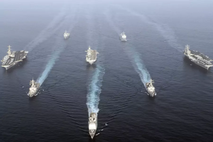 U.S. warships carrying 17,000 personnel enter the Gulf in a show of force off Iran's coast. (U.S. Fifth Fleet handout/courtesy Reuters)