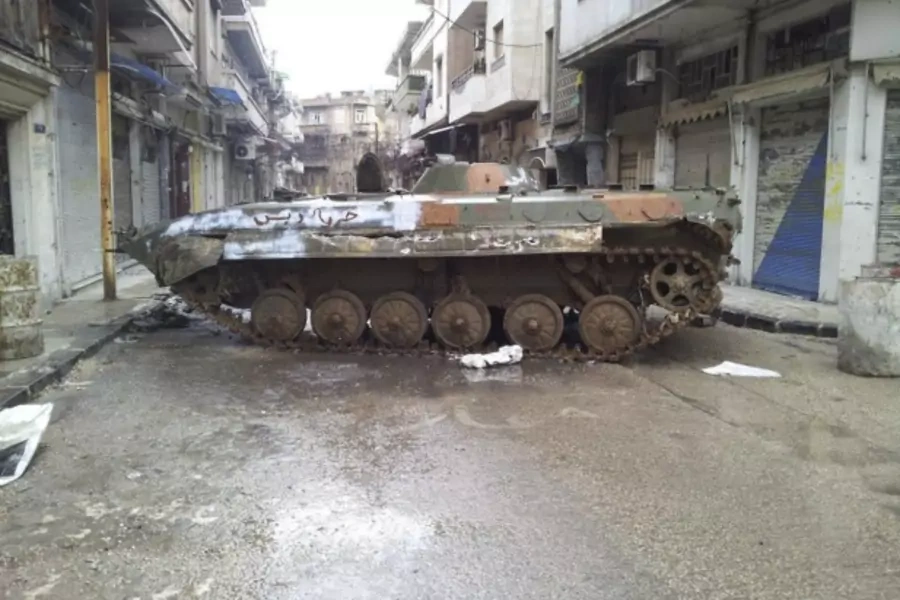 A damaged tank is seen in a neighbourhood in Homs, Syria, on February 23, 2012 (Courtesy Reuters/Stringer).