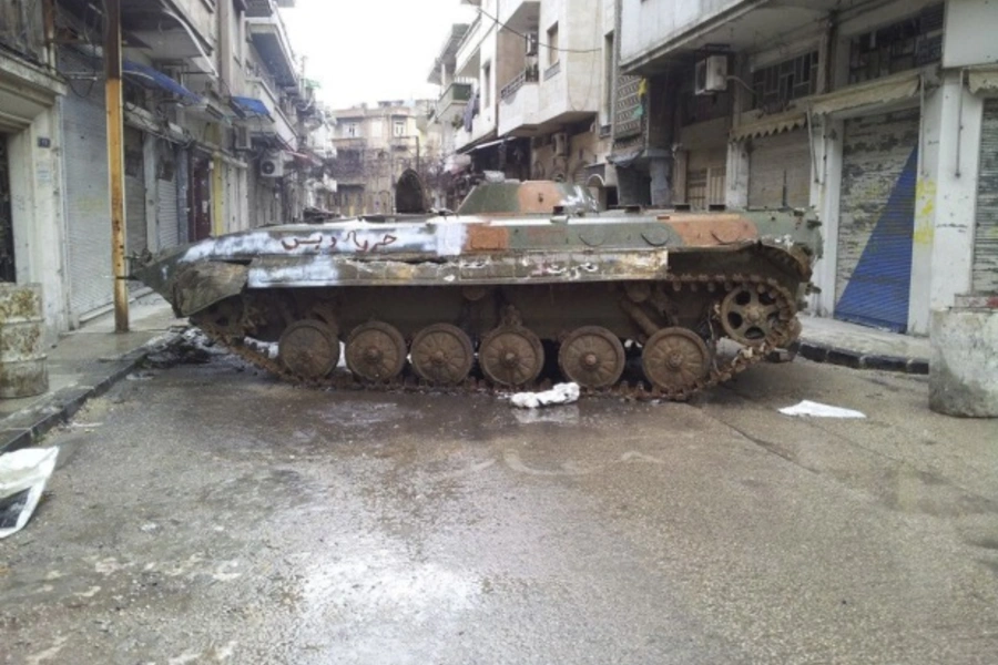 A damaged tank is seen in a neighbourhood in Homs, Syria, on February 23, 2012 (Courtesy Reuters/Stringer).