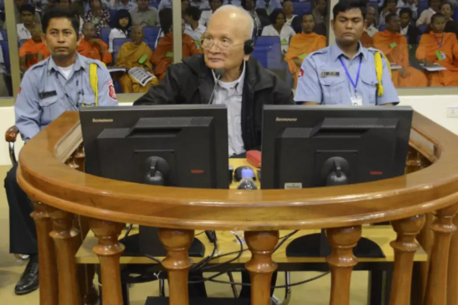 Former Khmer Rouge leader "Brother Number Two" Nuon Chea (C) sits in the court room at the Extraordinary Chambers in the Courts of Cambodia (ECCC) on the outskirts of Phnom Penh, December 5, 2011.