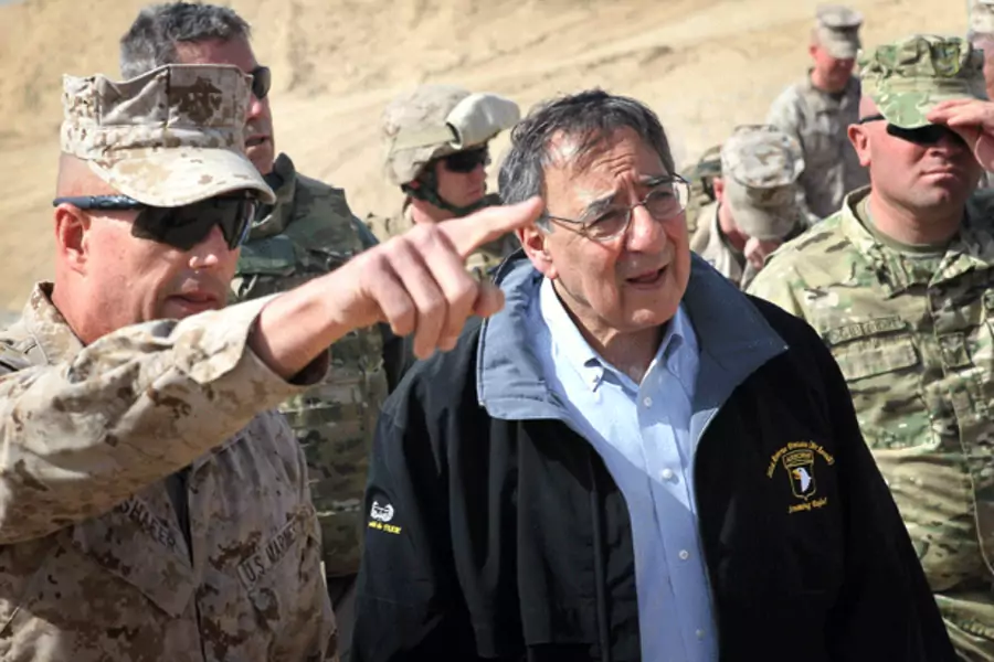 Defense Secretary Leon Panetta is greeted by Col. John Shafer (L) after arriving to greet troops at Forward Operating Base Shukvani, Afghanistan on March 14, 2012. (Scott Olson/Courtesy Reuters)