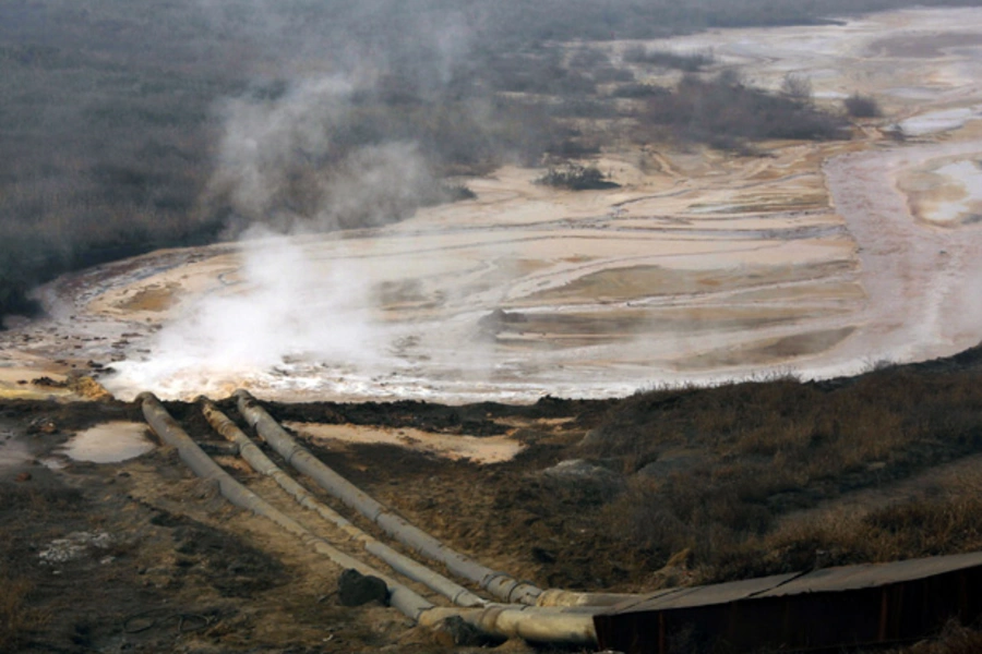 Pipes coming from a rare earth smelting plant spew polluted water into a vast tailings dam near Xinguang Village, located in China's Inner Mongolia Autonomous Region (David Gray/Courtesy Reuters).