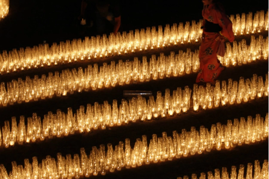 A girl walks through rows of candles at a September 2011 event in Kesennuma, Japan, to commemorate those who died in the earthquake and tsunami that struck Japan on March 11, 2011. (Kim Kyung Hoon/courtesy Reuters)