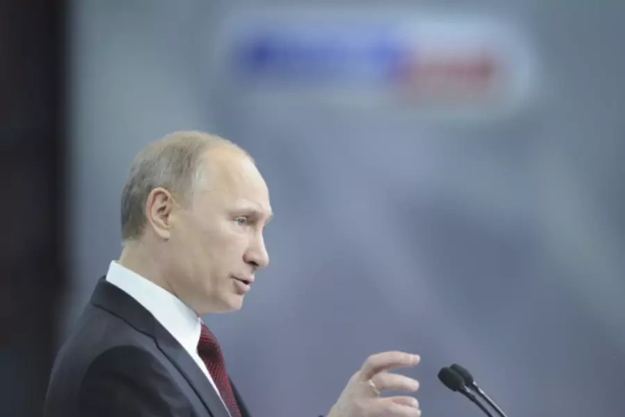 Russian Prime Minister Vladimir Putin speaks to supporters and political scientists in Moscow. (courtesy Reuters)
