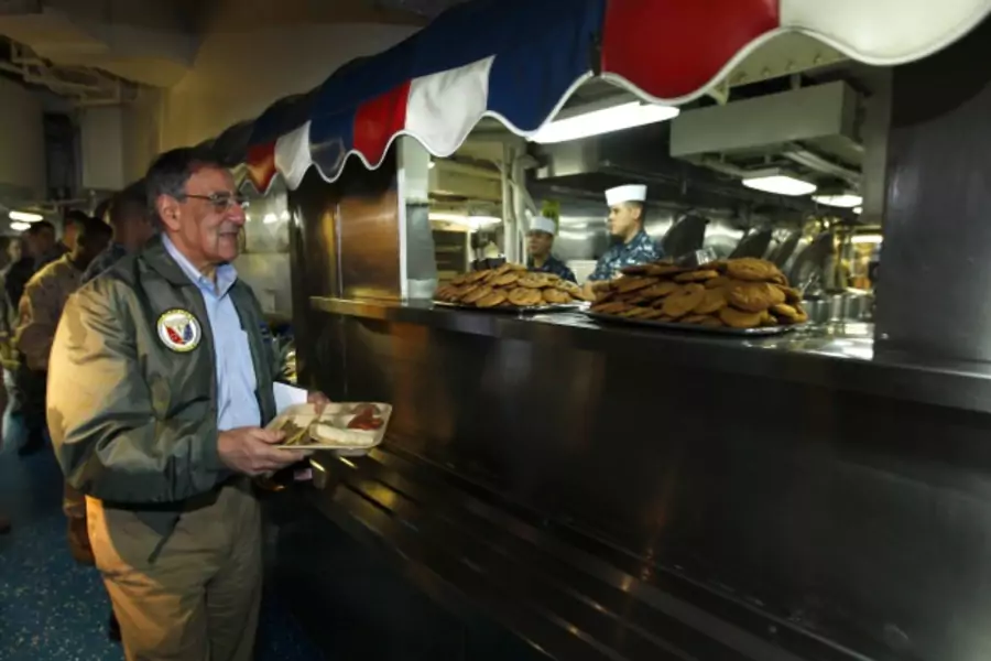 U.S. Secretary of Defense Leon Panetta gets his lunch aboard the USS Peleliu (Courtesy Reuters/Mike Blake).
