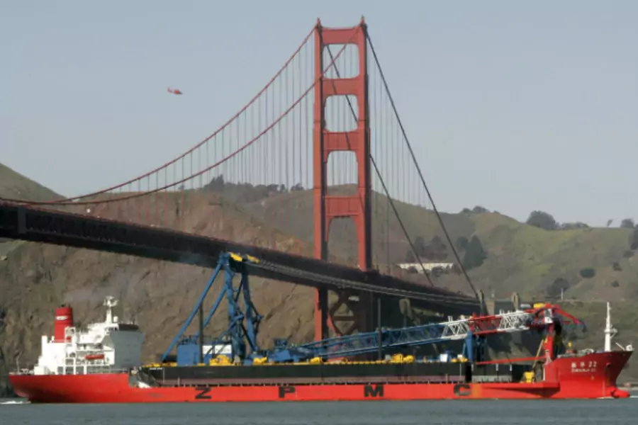 A ship-borne 300-foot crane positions itself for a Golden Gate Bridge construction project in March 2009. (Robert Galbraith/Courtesy Reuters)