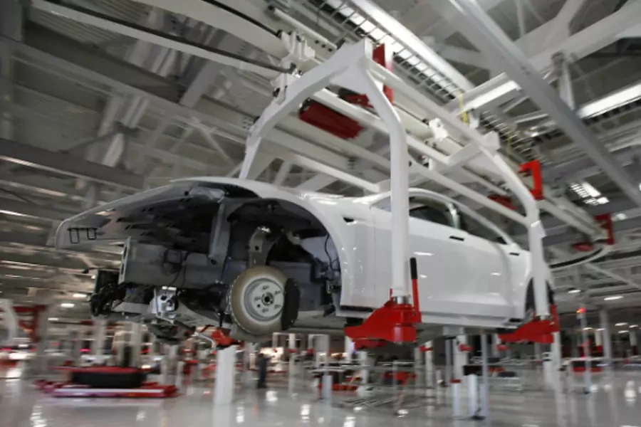 A Tesla Motors Model S is undergoing assembly at a Fremont, California factory—formerly co-owned by GM and Toyota—that Tesla purchased with the proceeds of a $465 million DoE loan. (Stephen Lam/Courtesy Reuters)