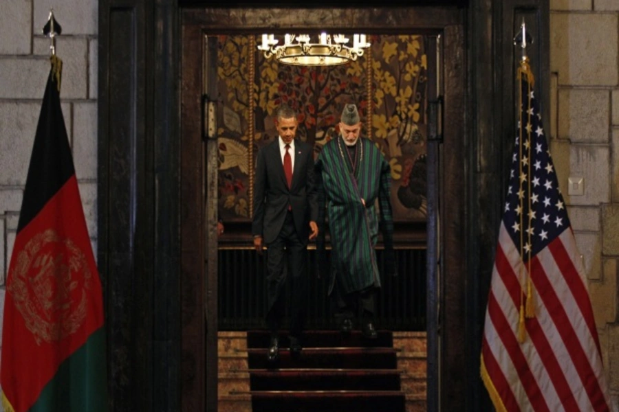 U.S. President Obama and Afghan President Karzai meet to sign the Strategic Partnership Agreement in Kabul on May 1, 2012 (Courtesy Reuters/Kevin Lemarque).