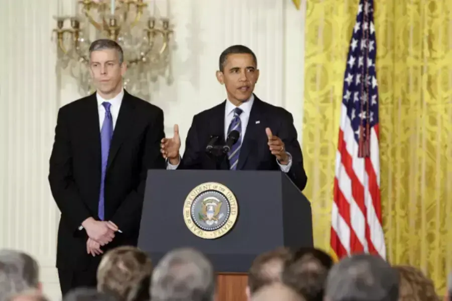 President Barack Obama discusses the first round of NCLB waivers on February 9, 2012 with Secretary of Education Arne Duncan looking on (Yuri Gripas/Courtesy Reuters).