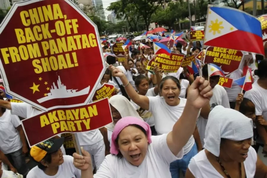 Filipinos chant anti-China slogans as they march towards the Chinese consulate in Manila's Makati financial district on May 11, 2012.