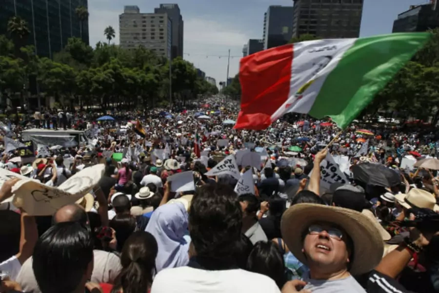 Members of the anti-PRI opposition movement "Yosoy132" take part in a protest in Mexico City