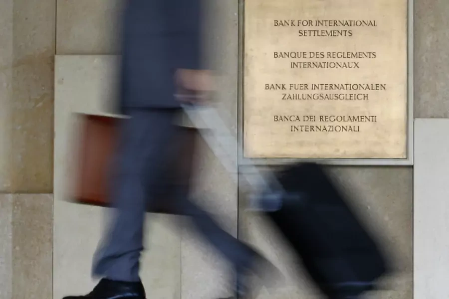A man enters the headquarters of the Bank for International Settlements, which sponsors the international Basel Committee on Banking Supervision that issued the Basel III rules (Christian Hartmann/Courtesy Reuters).