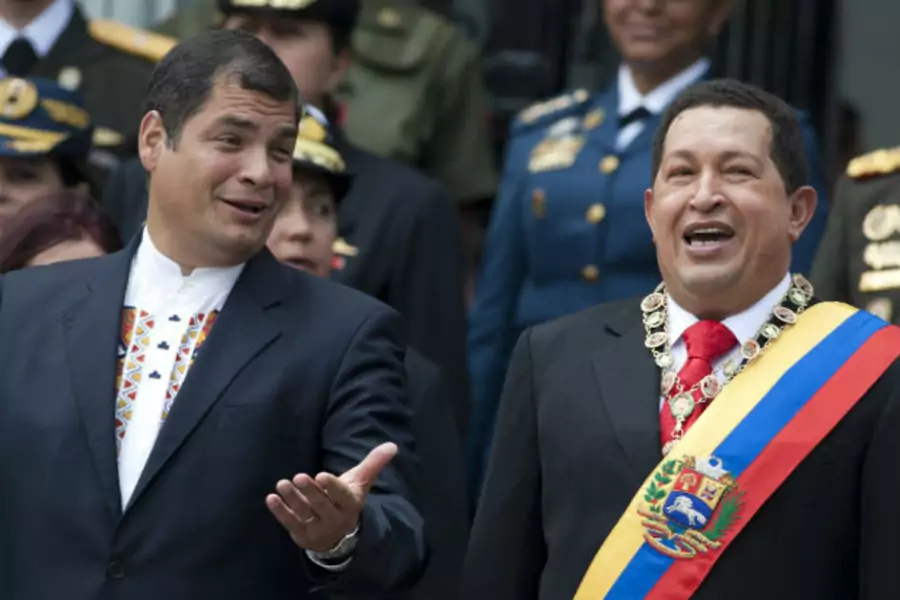 Ecuador's President Correa and Venezuela's President Chavez sing national anthem during a ceremony in Caracas
