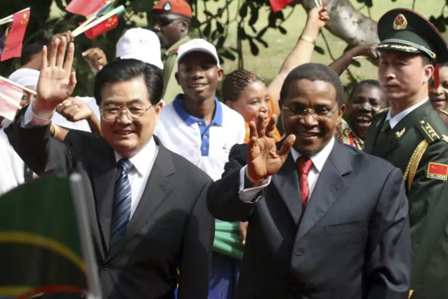 China's President Hu Jintao (L) and his Tanzanian counterpart Jakaya Kikwete wave to a crowd upon their arrival at the State House in Dar es Salaam, Tanzania on February 15, 2009 (Courtesy Reuters).