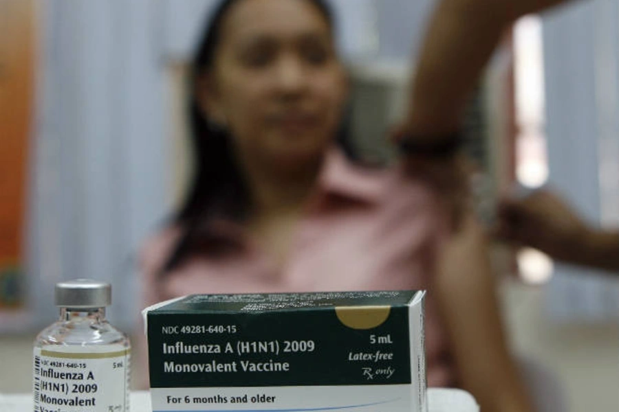 A health worker gets a single dose of influenza vaccine in Mandaluyong City in the Philippines on April 26, 2010. At least 1.9...ganization (WHO) will be used to vaccinate more than 36,000 health workers, as part of the country's response to the pandemic.