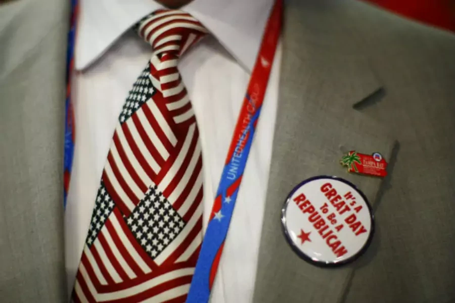 A convention goer wears a button during the second day of the Republican National Convention in Tampa