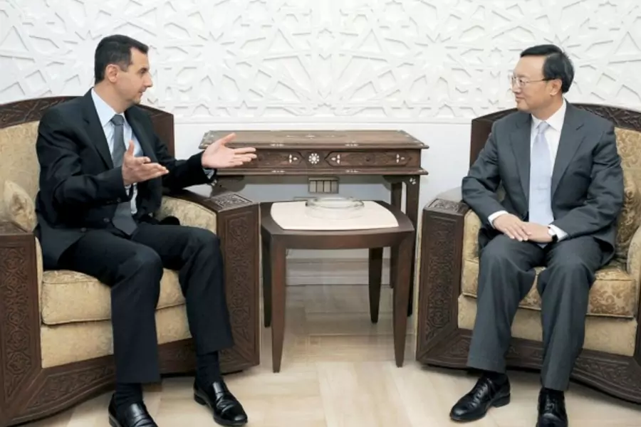 Syria's President Bashar al-Assad (L) meets China's Foreign Minister Yang Jiechi in Damascus on April 26, 2009.